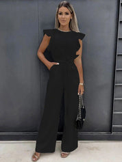Chic elfenbensvit jumpsuit med elegant rosett detalj