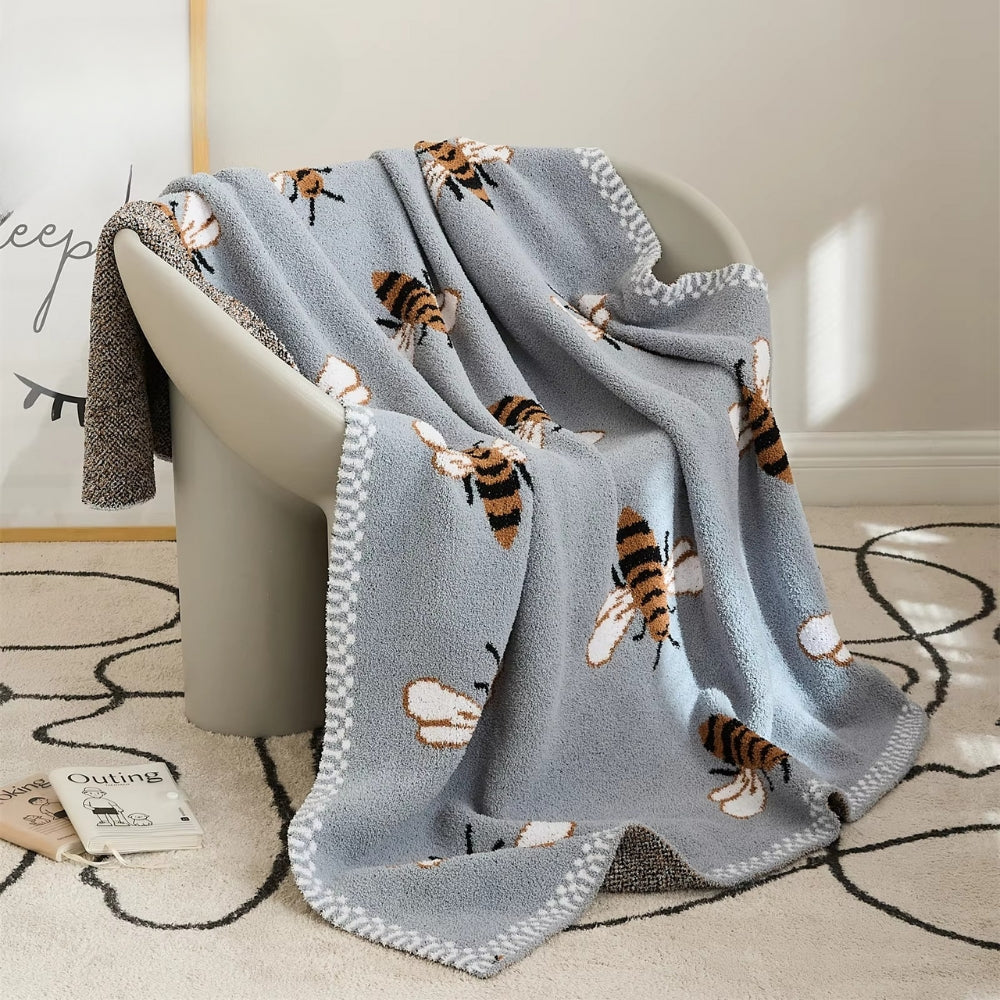 Kuschelige Decke mit Bienenmuster für Gemütlichkeit und Stil 0
