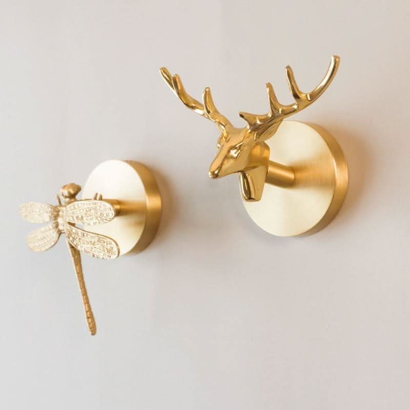 Wandhakenleiste aus Messing mit Tiermotiven und goldenen Akzenten 2